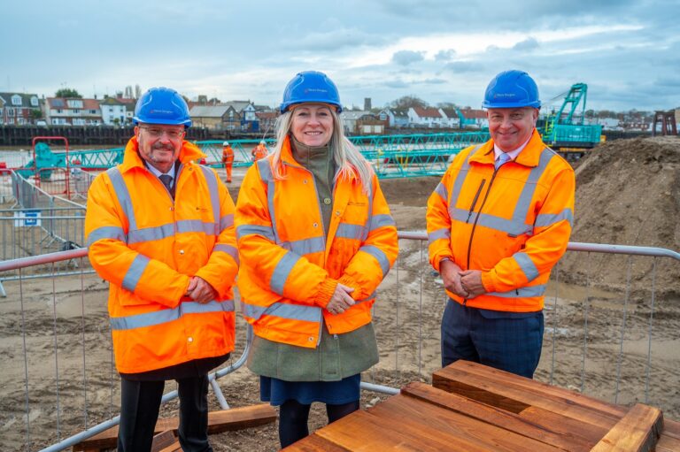 Photo of three people at the beginning of works at Great Yarmouth